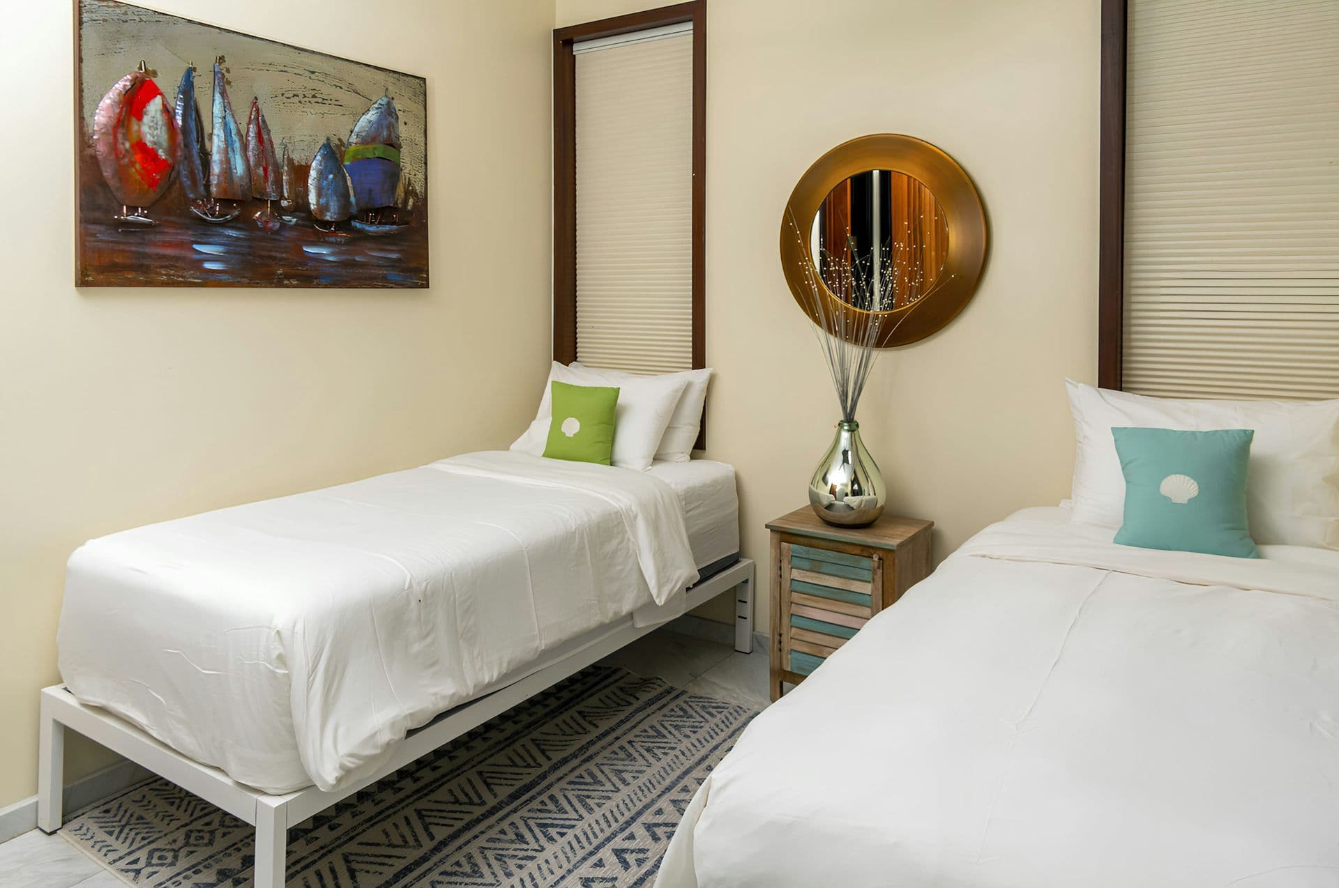 Twin bedroom in bright coastal tones at Life in Love, Antigua