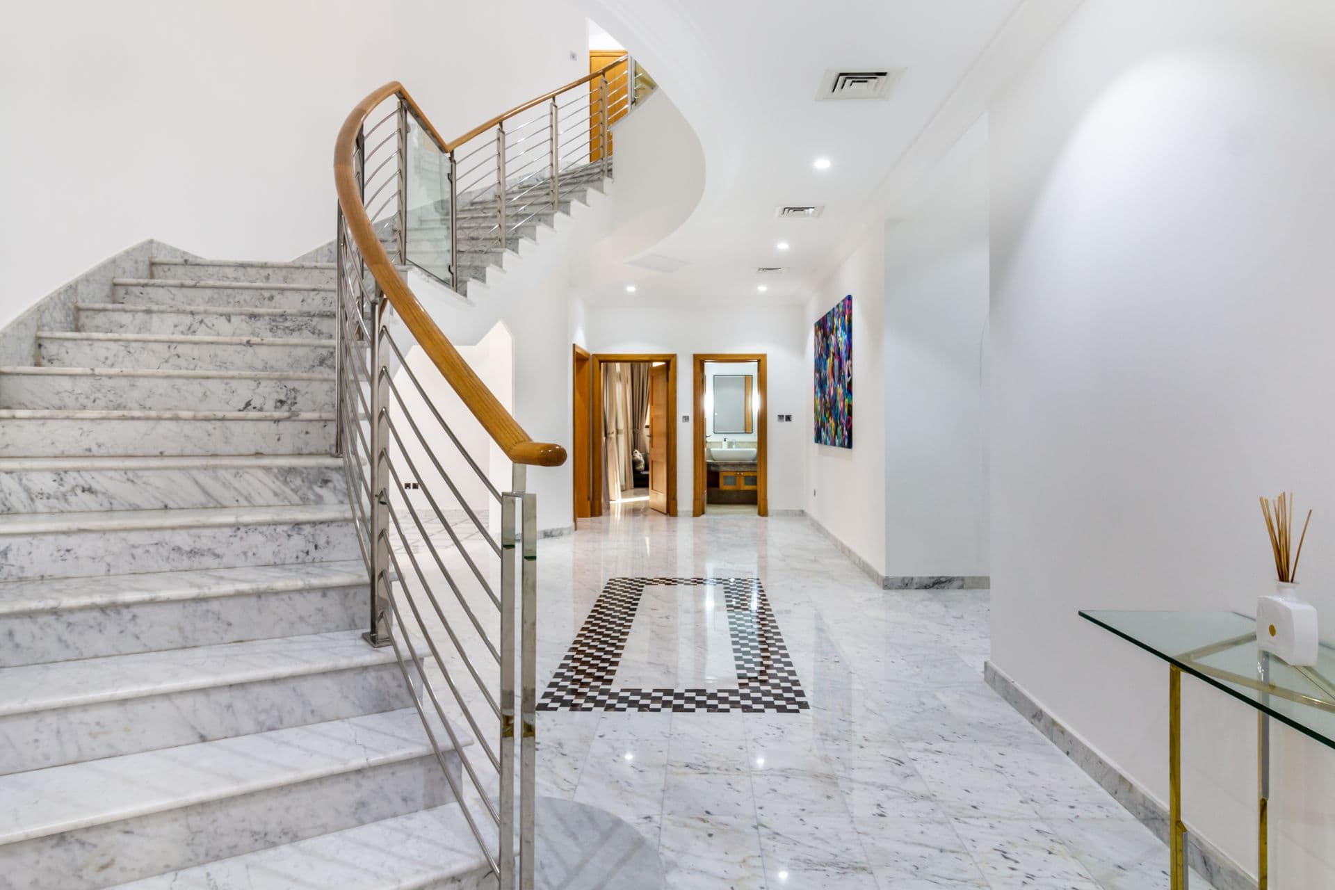 Marble staircase with steel and glass balustrade