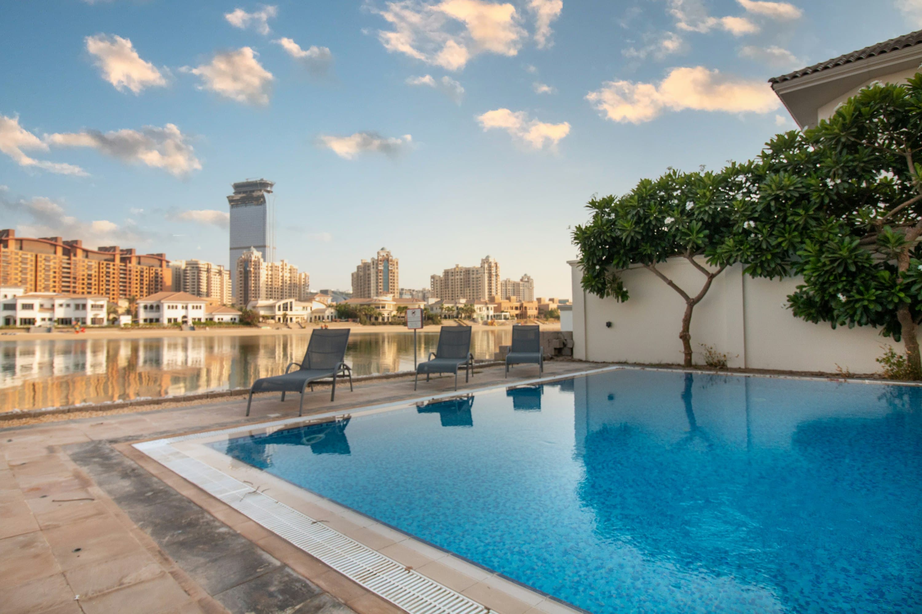 Summer on the Water private outdoor pool with Palm Jumeirah waterway views, Dubai, UAE
