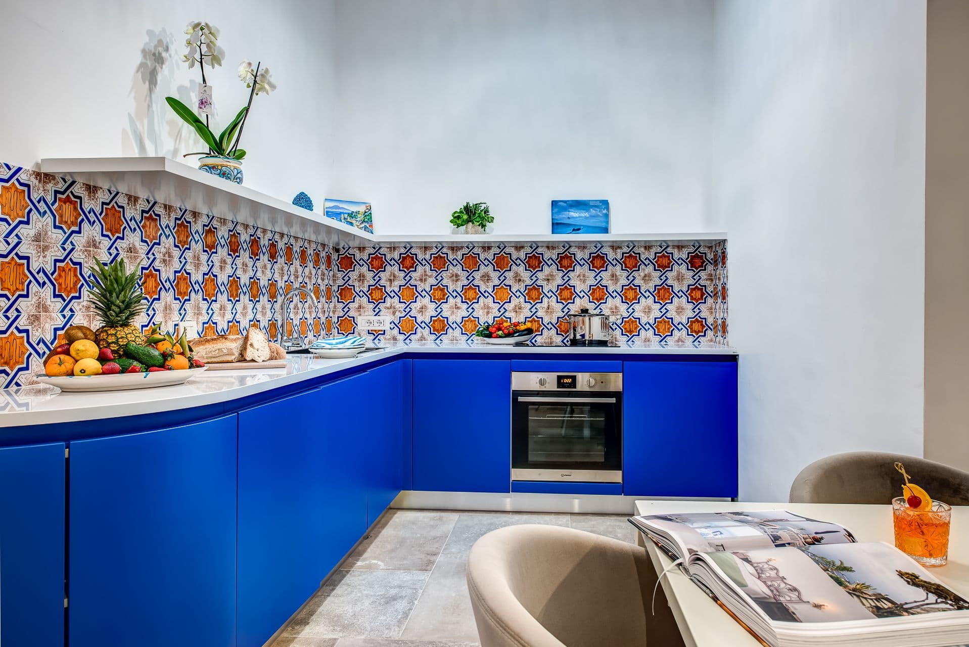 Kitchen with cobalt blue cabinetry and hand painted Vietri tiles at Mount of Love