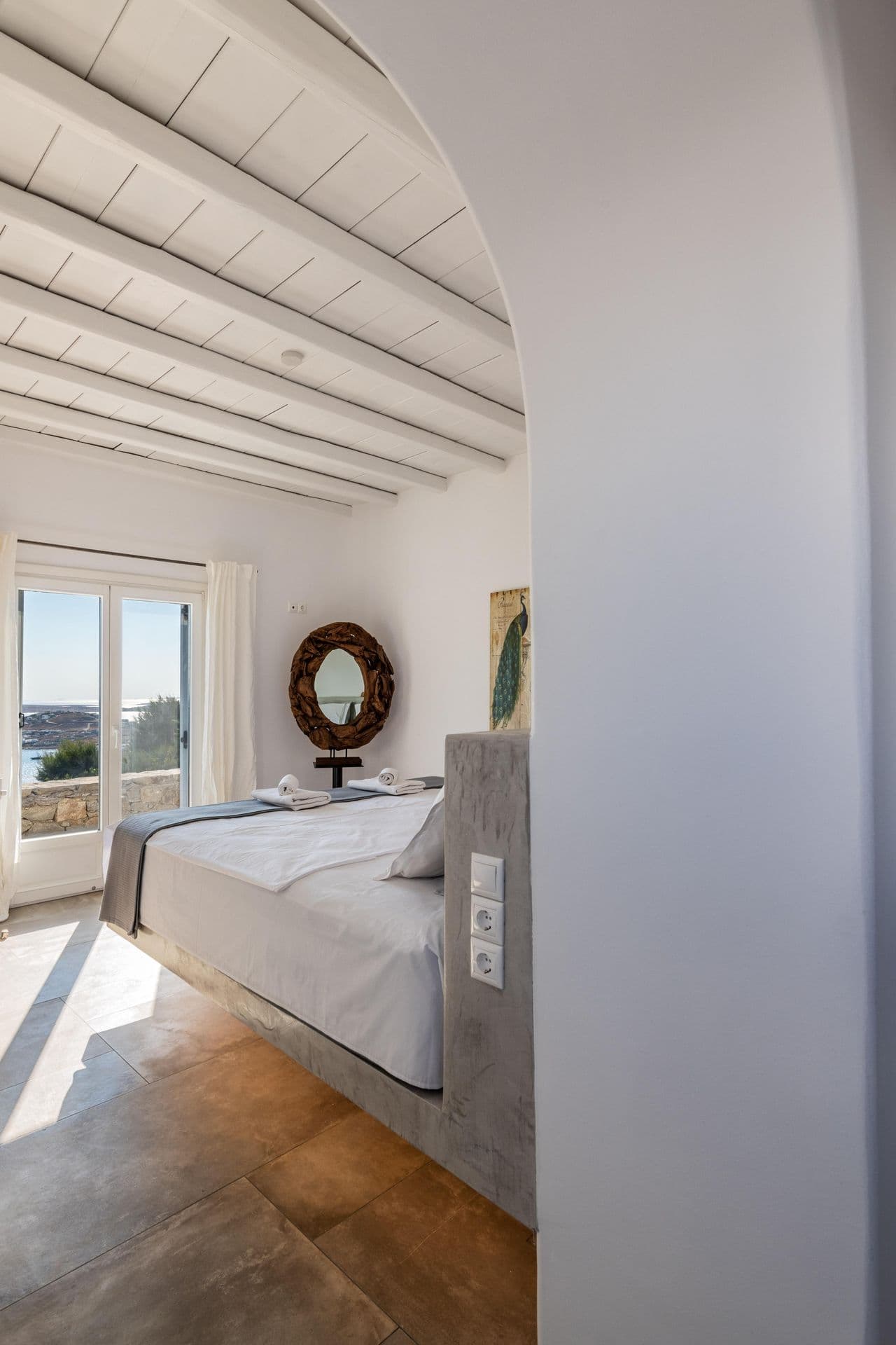 Bedroom hallway with sea-facing window at Party Invitation villa