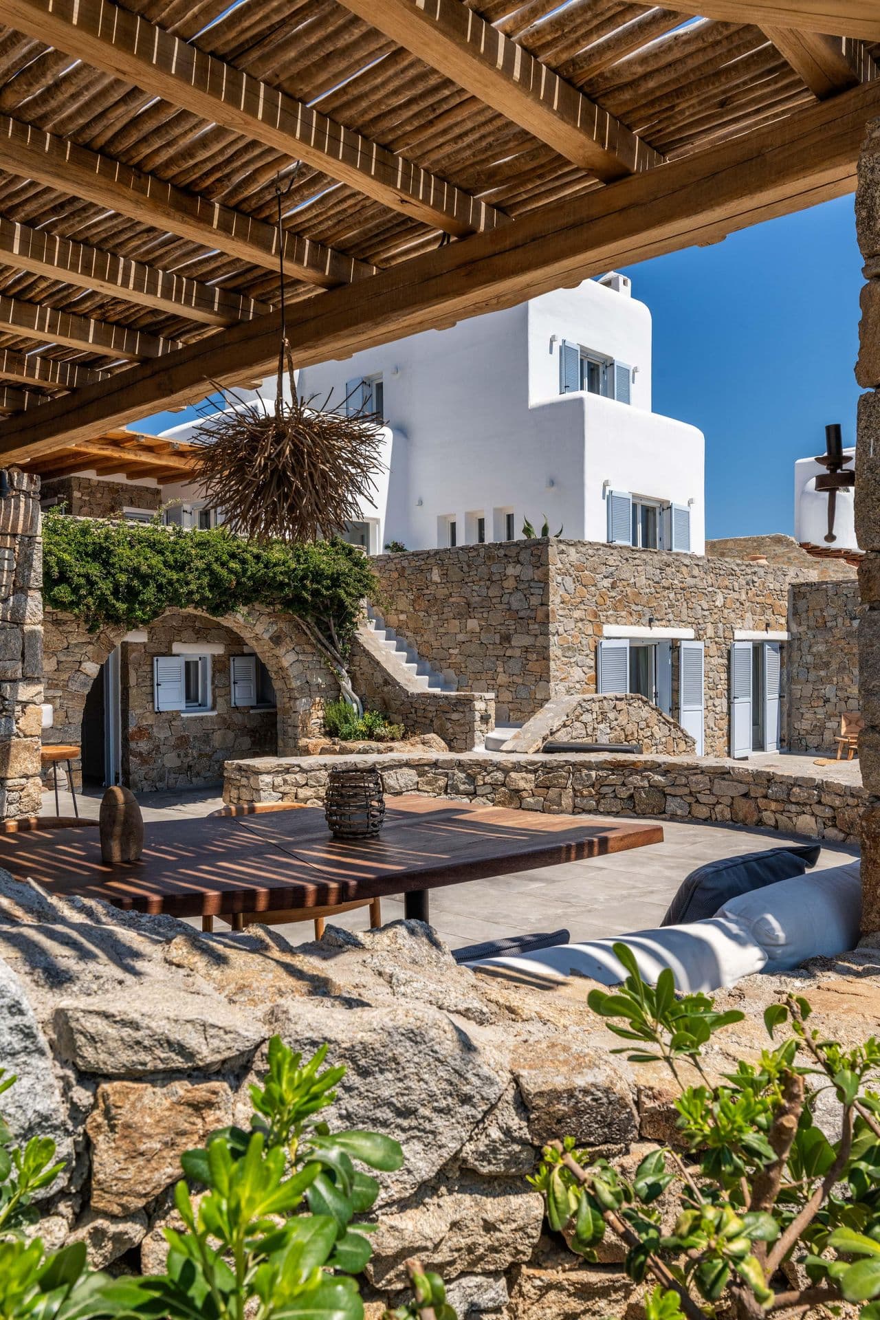 Covered courtyard lounge seating area at Party Invitation villa