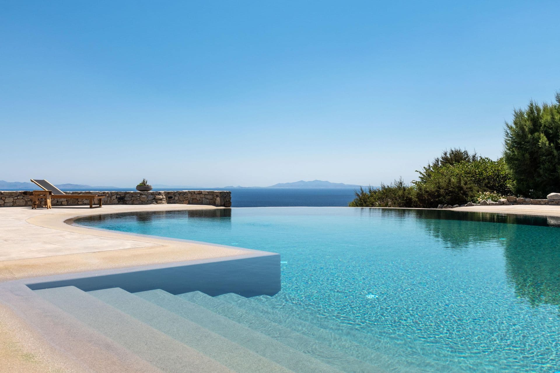 Infinity pool at Party Invitation villa in Mykonos overlooking the Aegean Sea