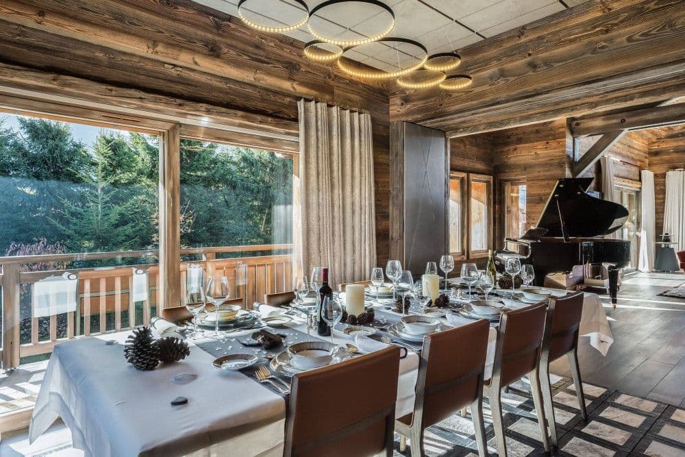 Dining room set beside a grand piano at Mont d'Arbois 4
