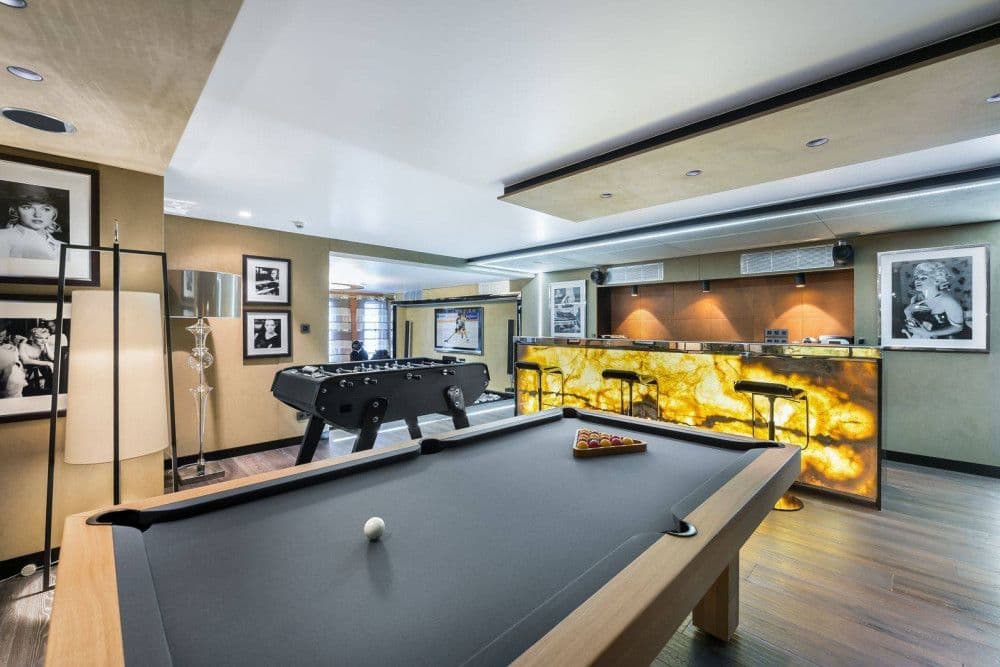 Games room with a pool table, foosball and bar at Mont d'Arbois 4