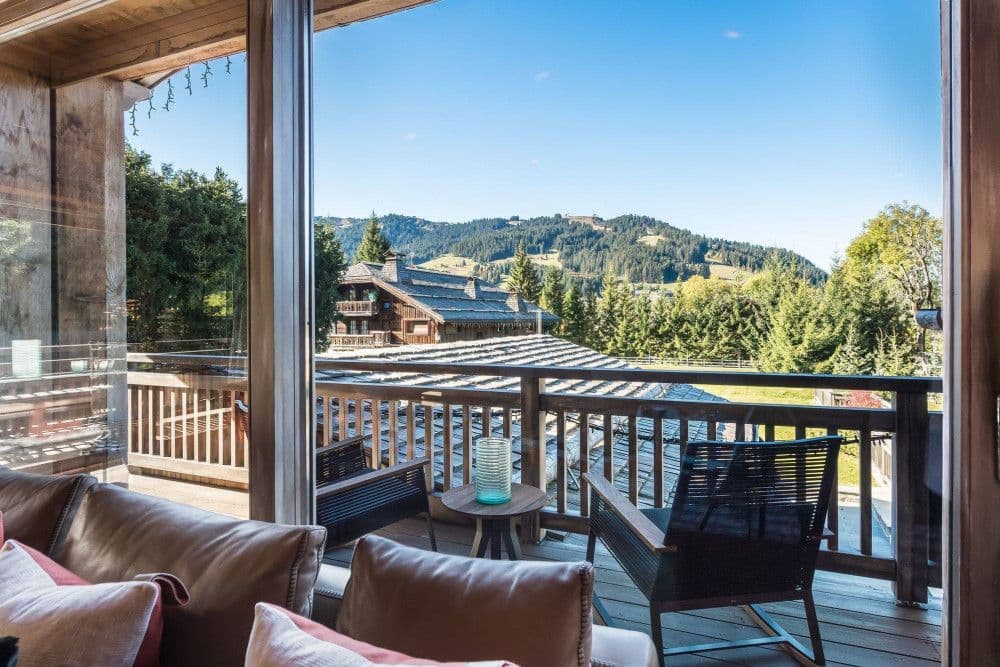 Covered terrace lounge with mountain views at Mont d'Arbois 4, Megeve