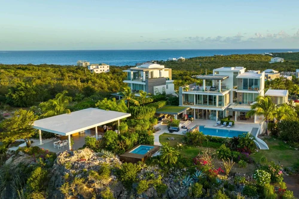 Aerial view of Little Bay Villas showing the pools, hot tub, gazebo and sea