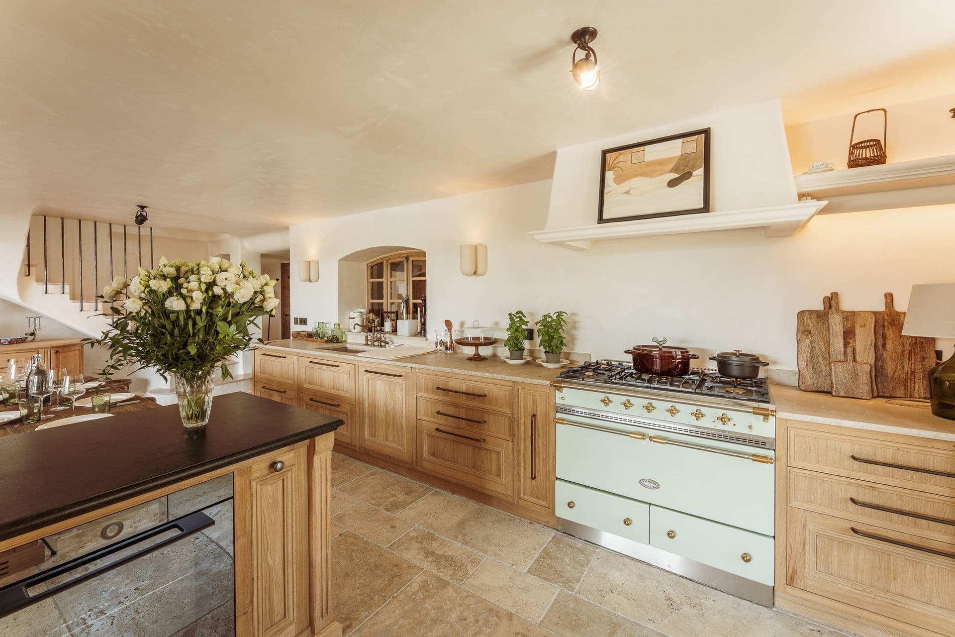 Farmhouse kitchen with cream range cooker and central island