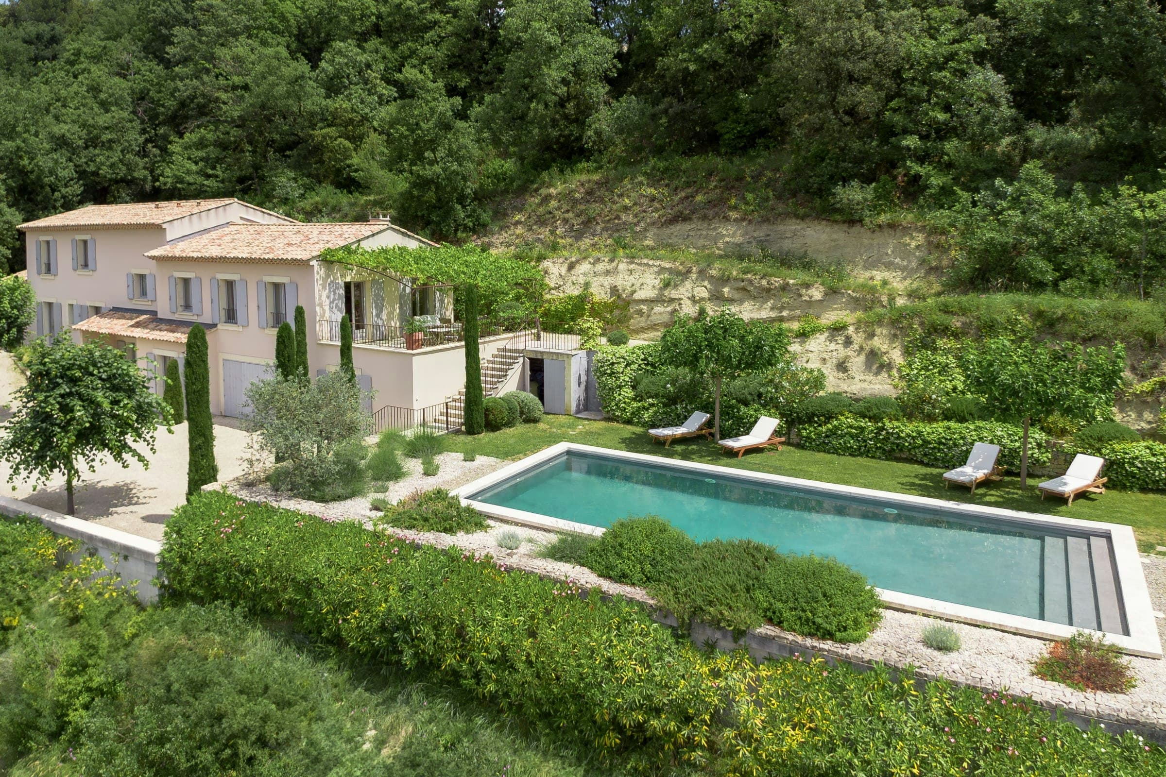 Little Luberon villa aerial view with terracotta roofs and pool, Ménerbes, Provence, France