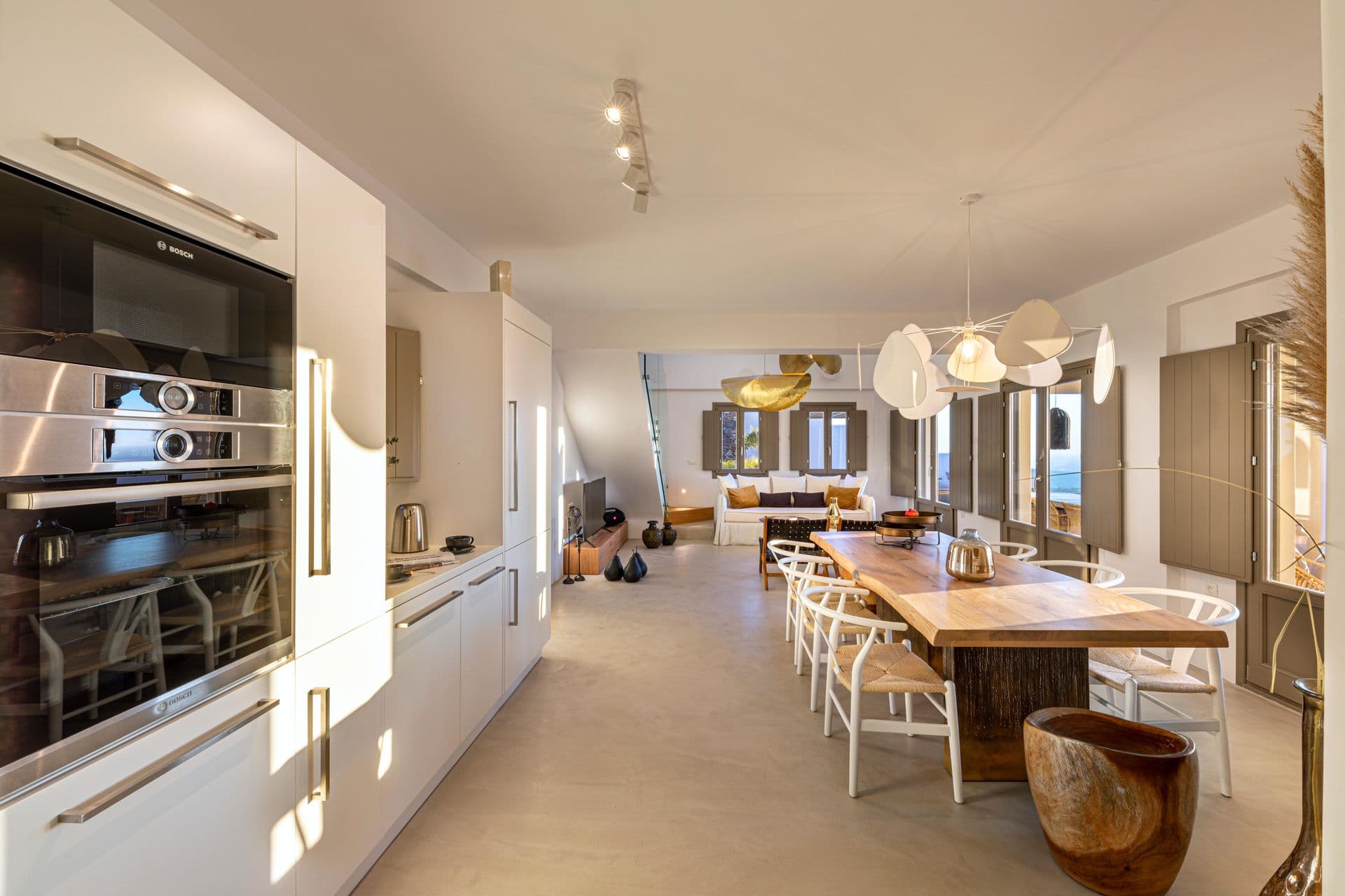 Open-plan kitchen and dining hall at Smile Upon You villa