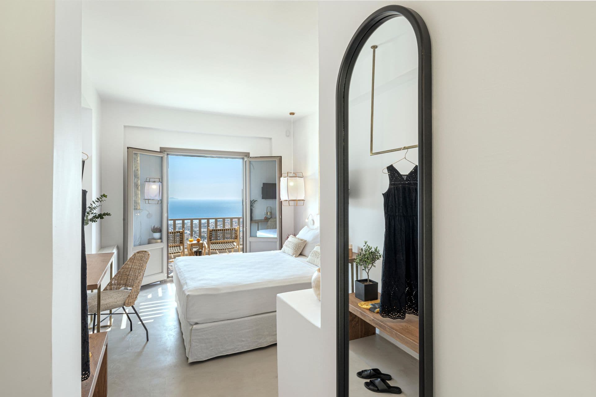 Master bedroom with sea view and dressing mirror at Smile Upon You