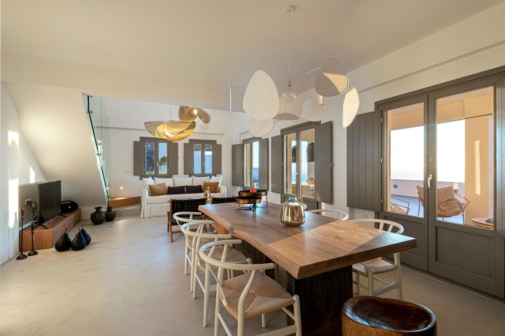 Second dining area with wishbone chairs at Smile Upon You