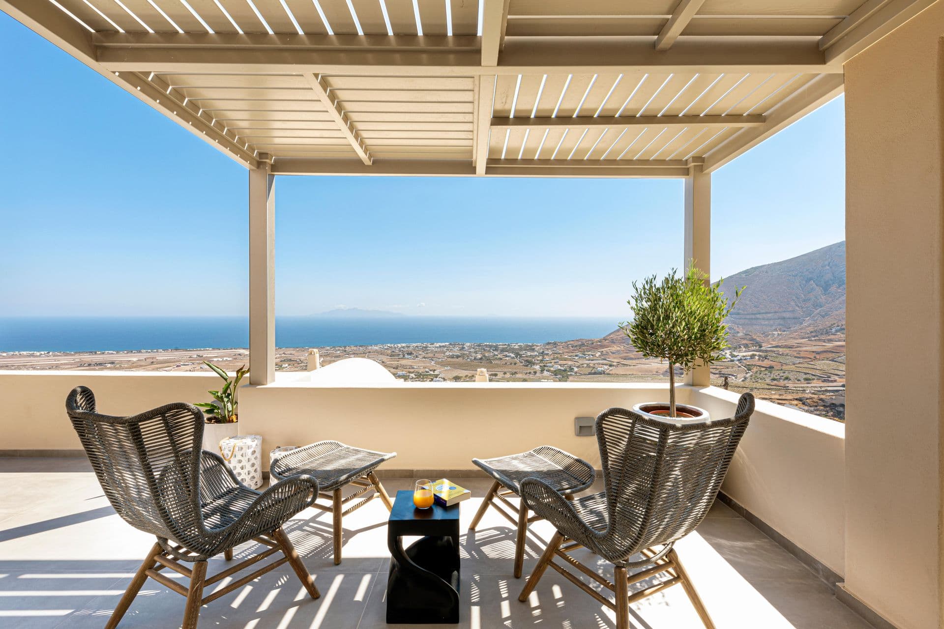 Covered terrace dining area with panoramic Aegean Sea views at Smile Upon You