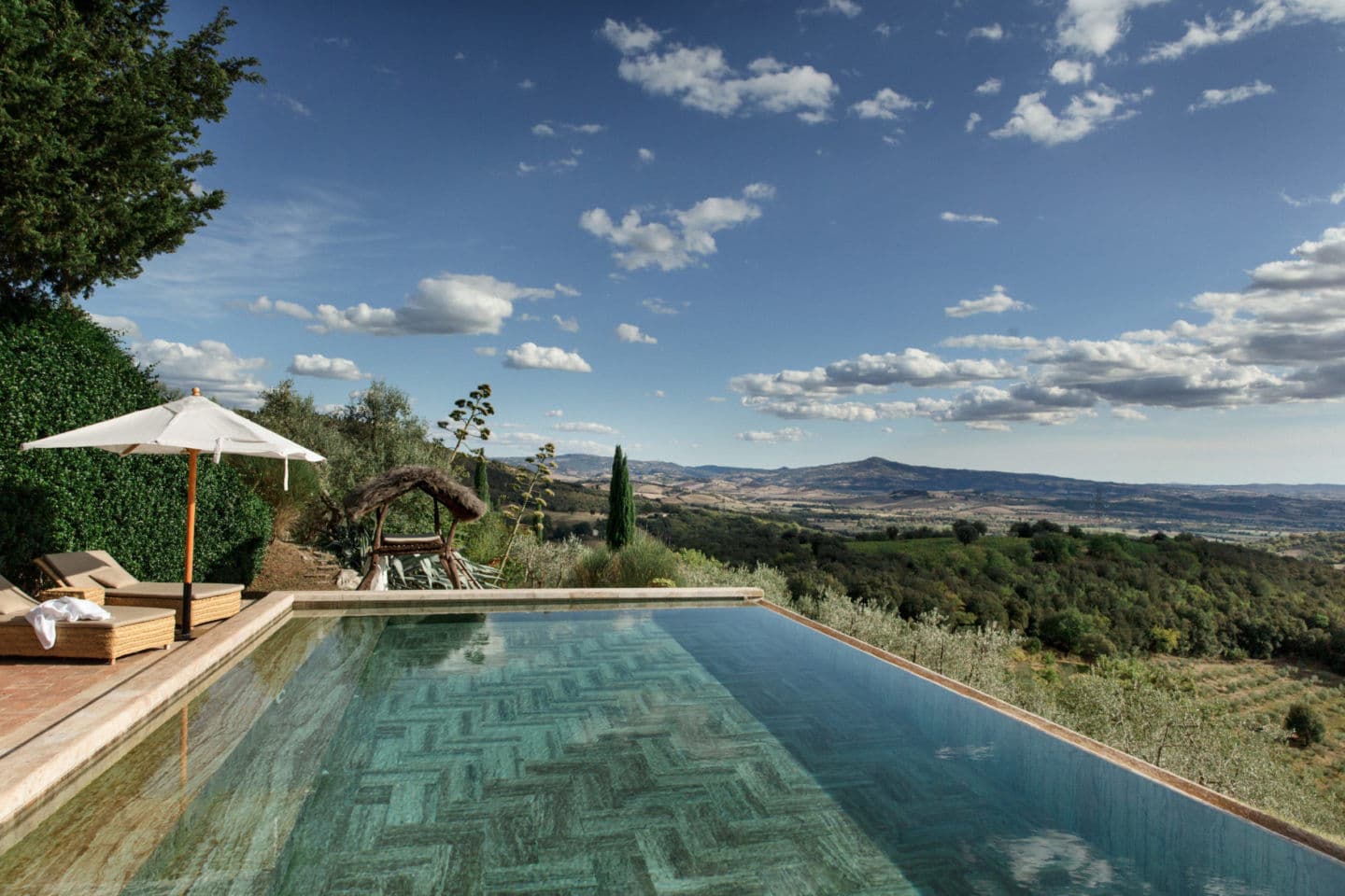 Villa Fortaleza infinity pool at sunset with valley views, Province of Grosseto, Tuscany, Italy