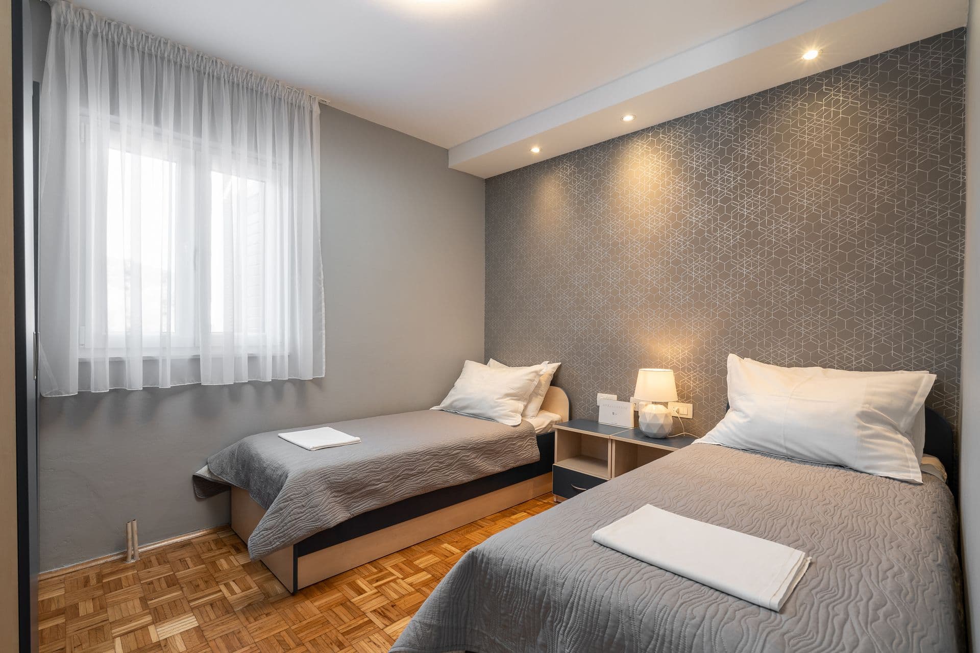 Double bedroom with sliding doors to a sea-view balcony at Blue All Around, Marina, Croatia