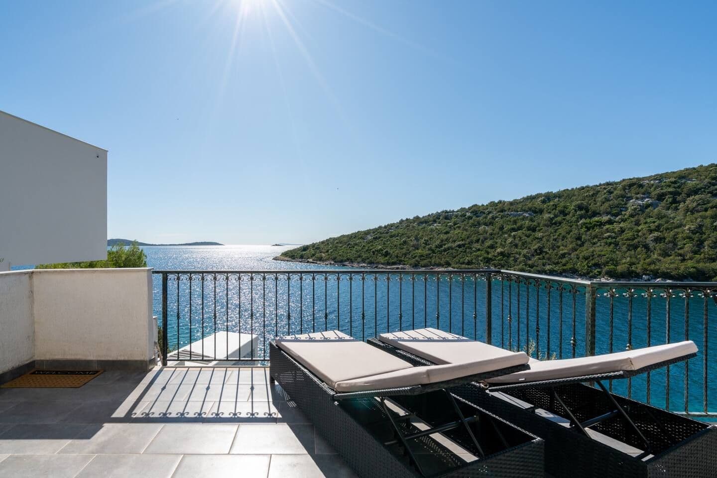 Outdoor dining table on a sea-view terrace at Blue All Around, Marina, Croatia