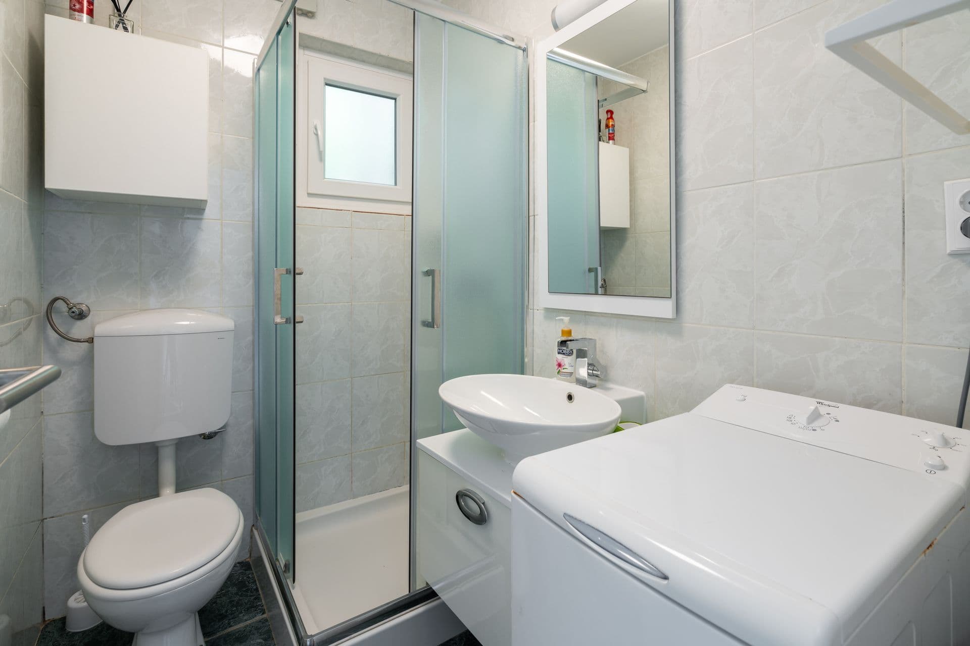 Double bedroom with a wardrobe and balcony onto the sea at Blue All Around, Marina, Croatia