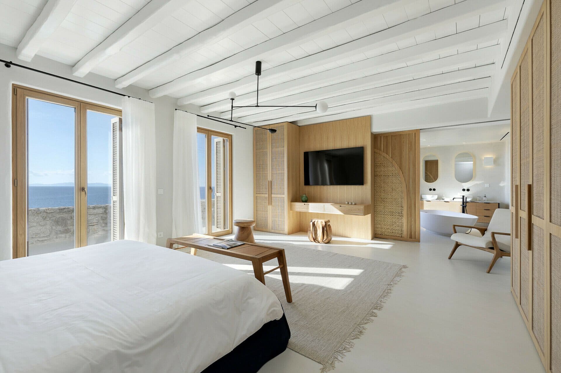 Double bedroom with a sitting area and sea views at Cycladic Wonder, Mykonos