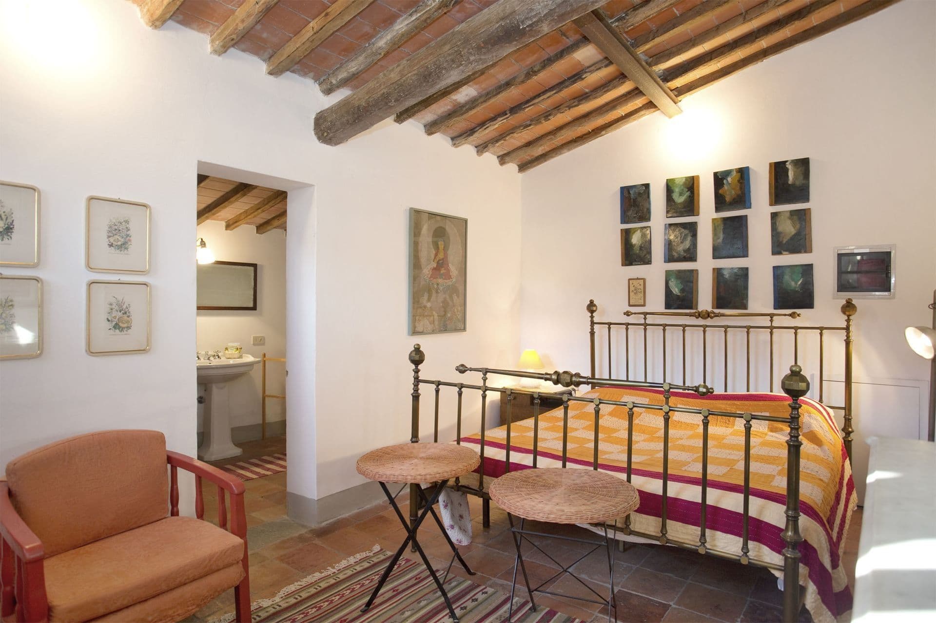 Bedroom with wrought-iron bed frame at Picturesque Hideaway