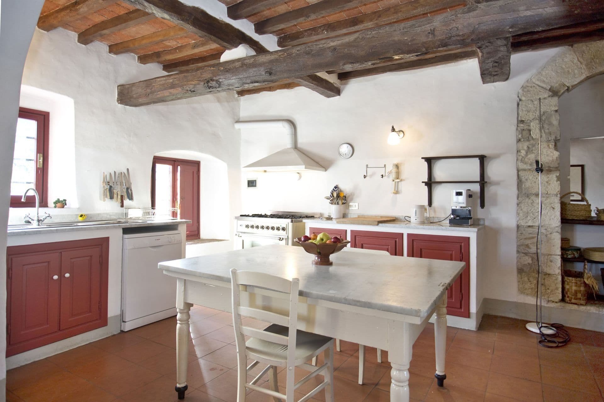 Farmhouse kitchen with beamed ceiling at Picturesque Hideaway