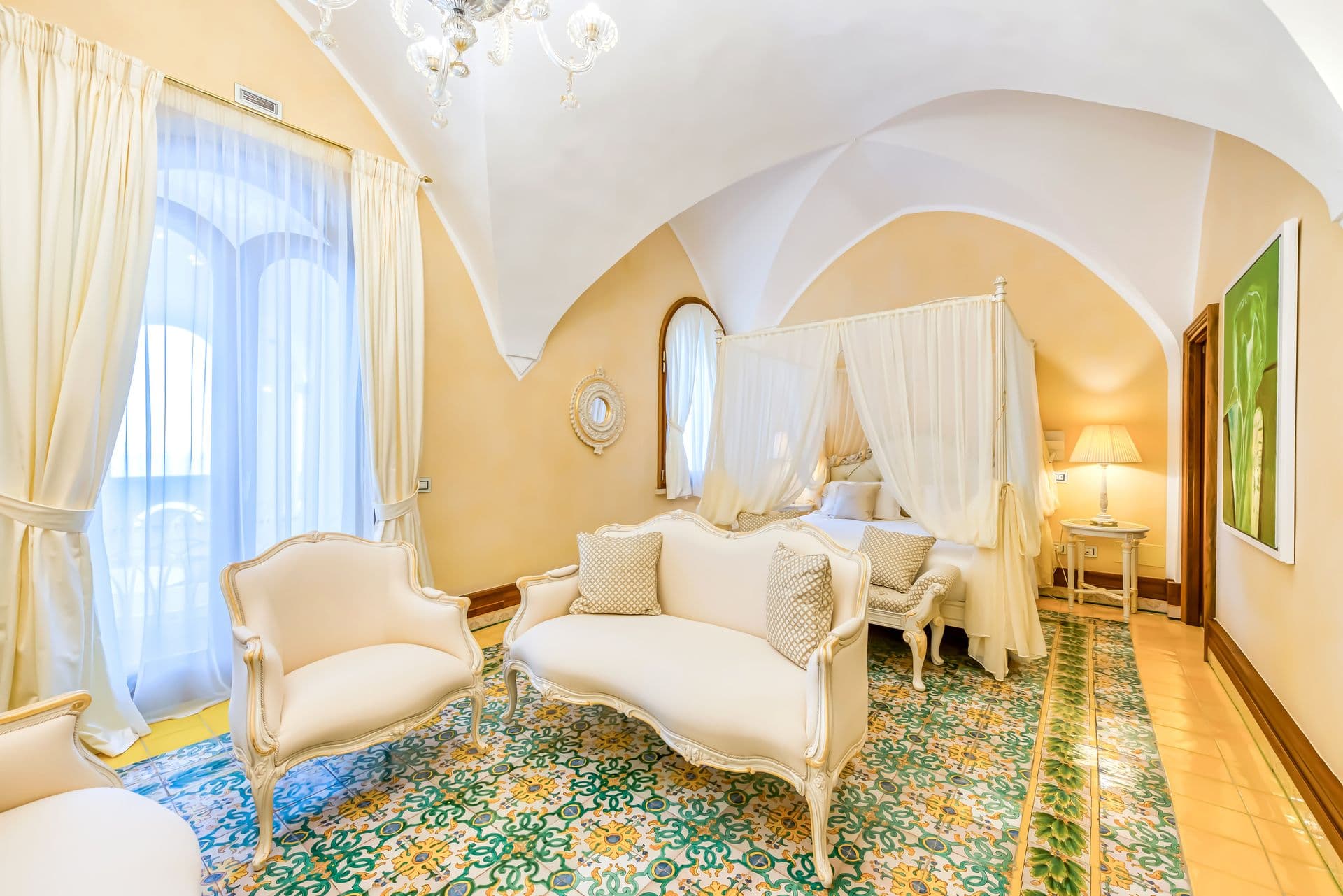 Breakfast room with mosaic floor and mirrored console
