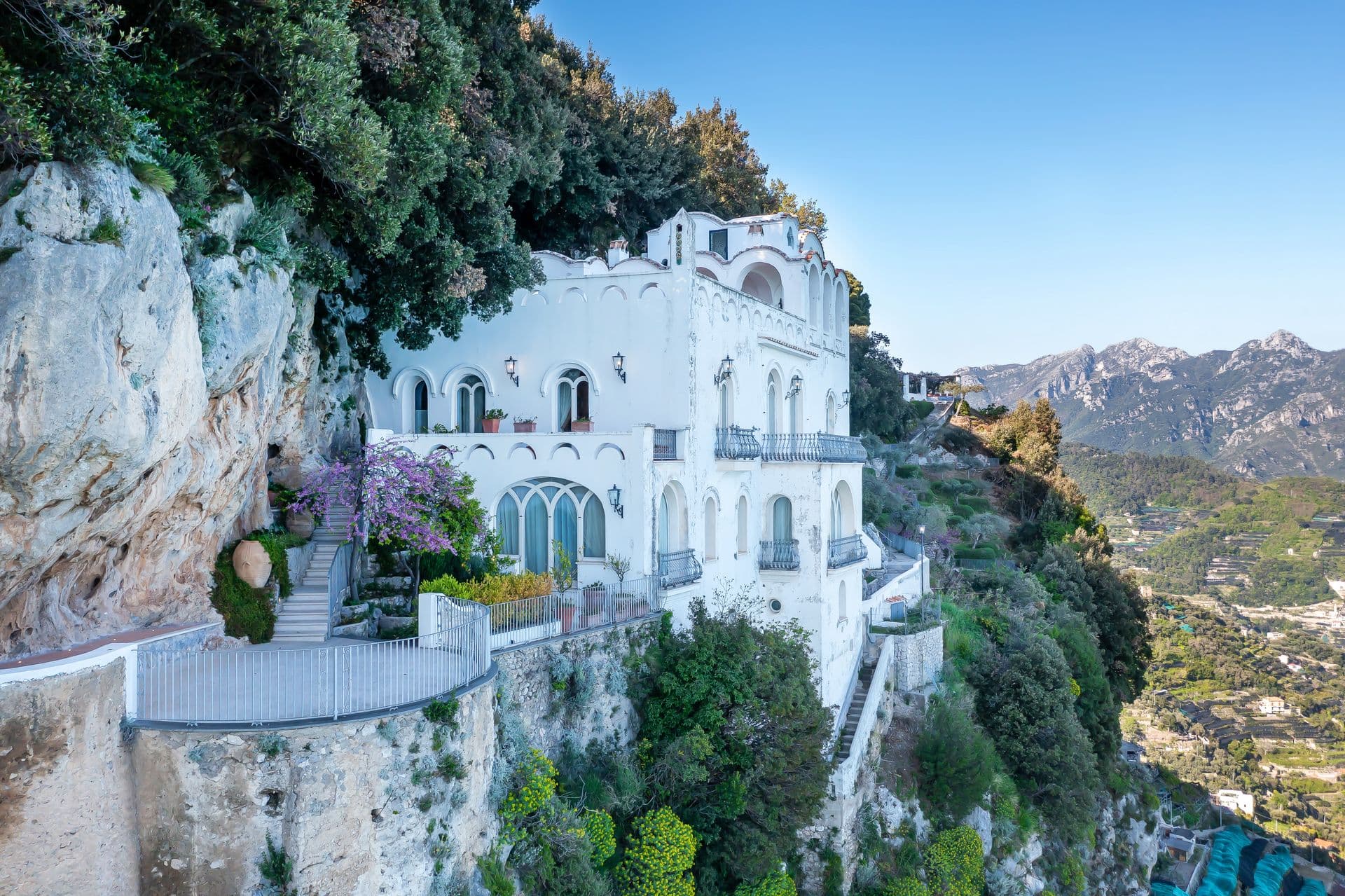 The Enchanting Terrace's white cliffside villa perched above the Amalfi Coast in Ravello