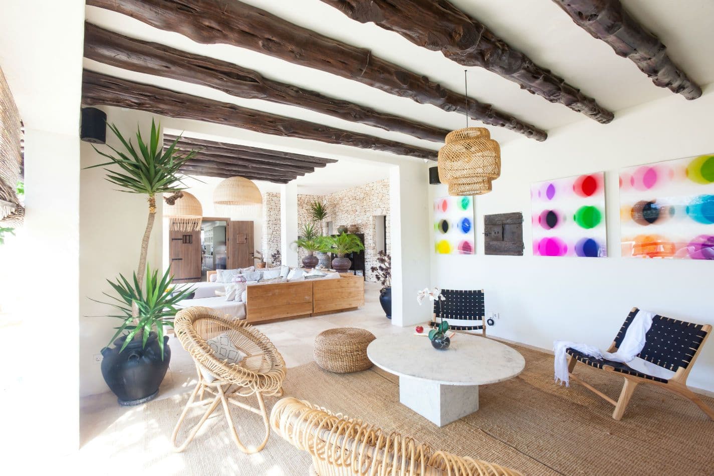 Terrace lounge area beside a colourful contemporary art wall