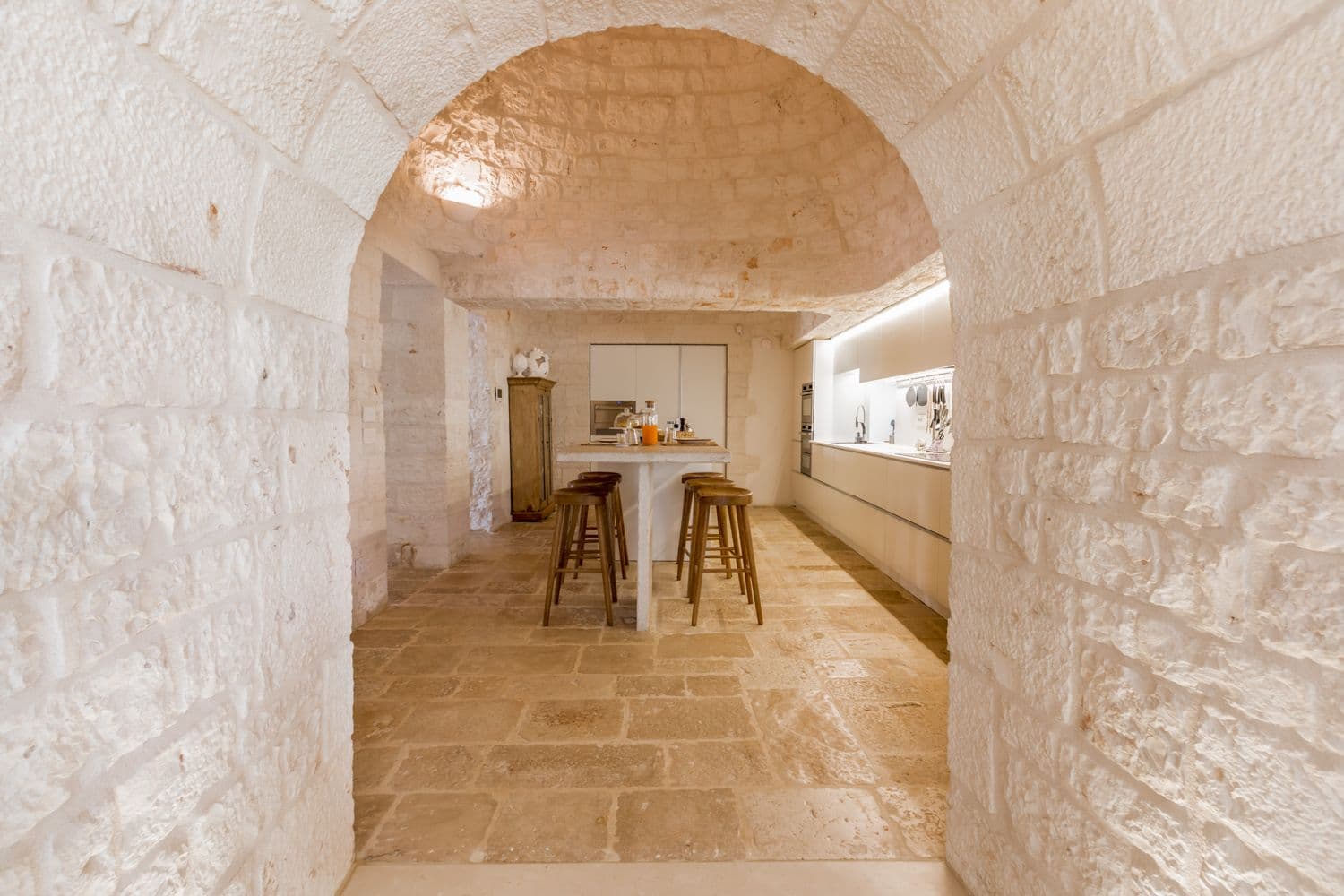 Trullo Barbagianni traditional kitchen with vaulted stone ceiling, Cisternino, Puglia, Italy