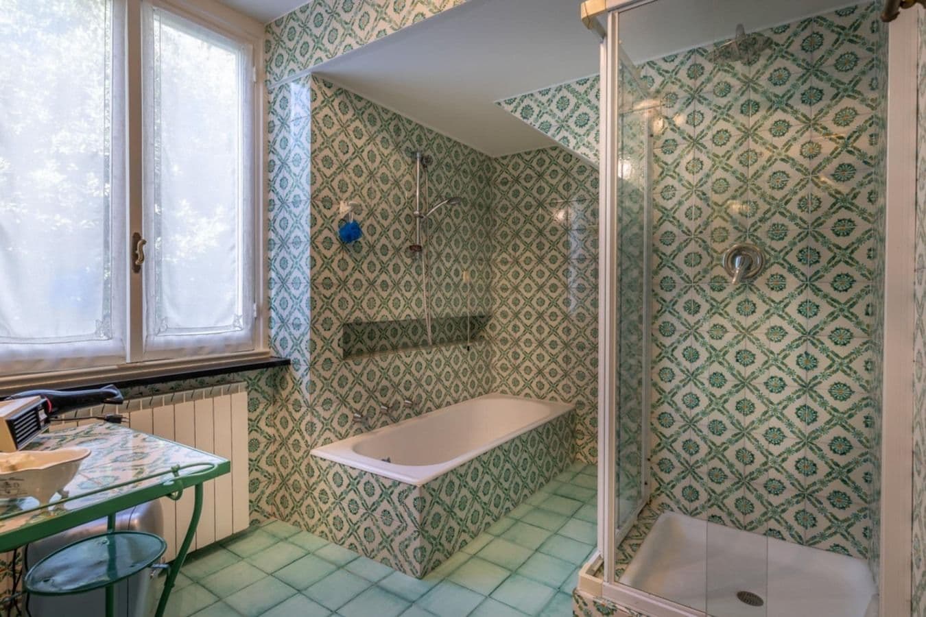 Patterned tile bathroom with bathtub at On the Emerald Coast, Rapallo