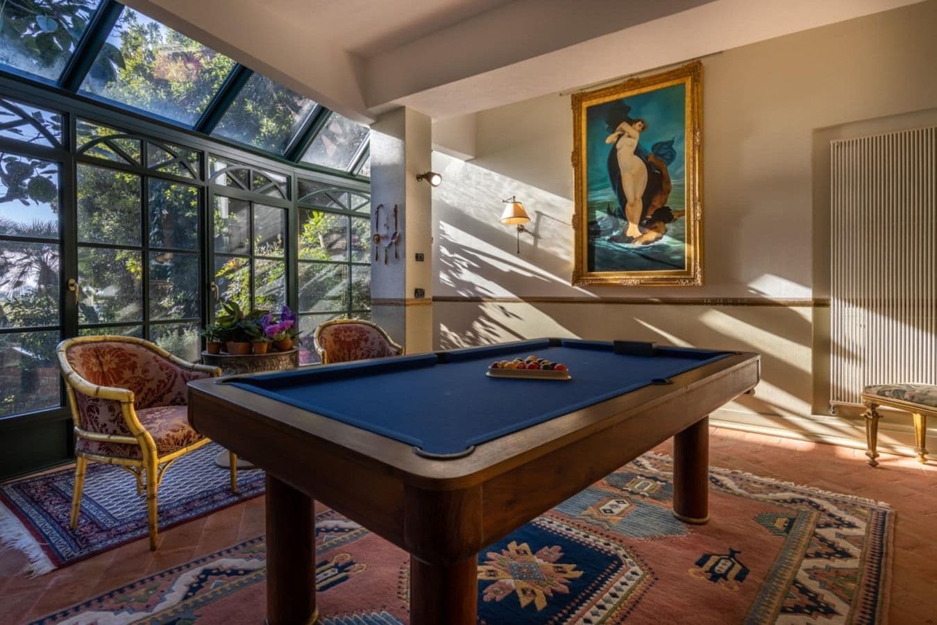 Sunroom billiards room with garden outlook at On the Emerald Coast, Rapallo