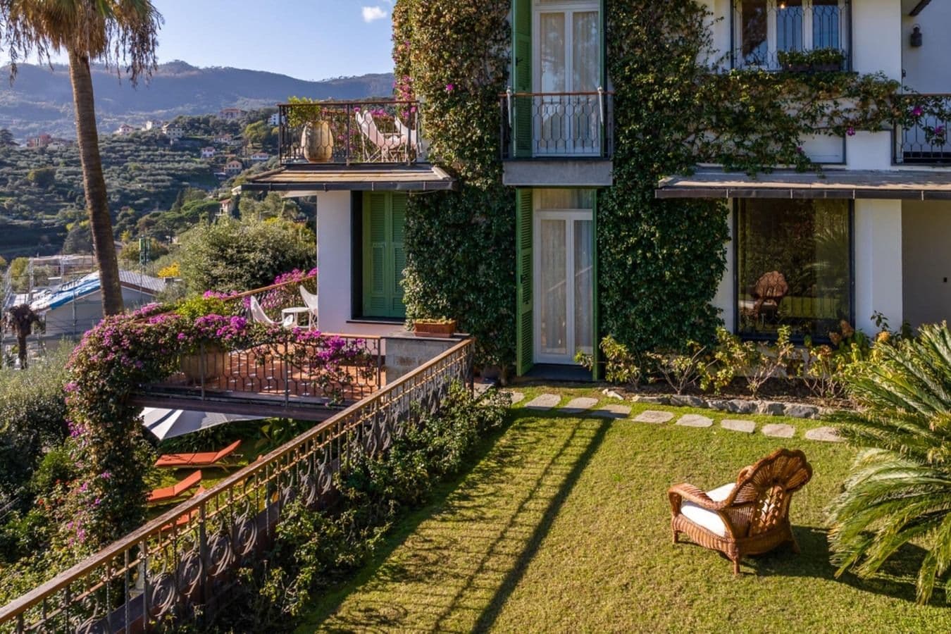 Ivy-covered villa exterior and garden at On the Emerald Coast, Rapallo