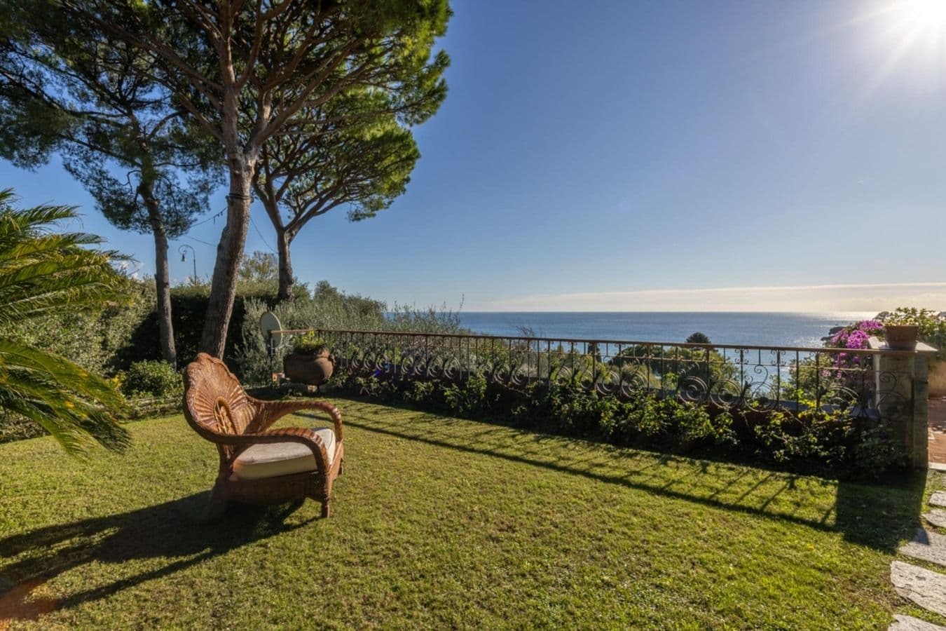 Lawned garden with pine trees and sea view at On the Emerald Coast, Rapallo