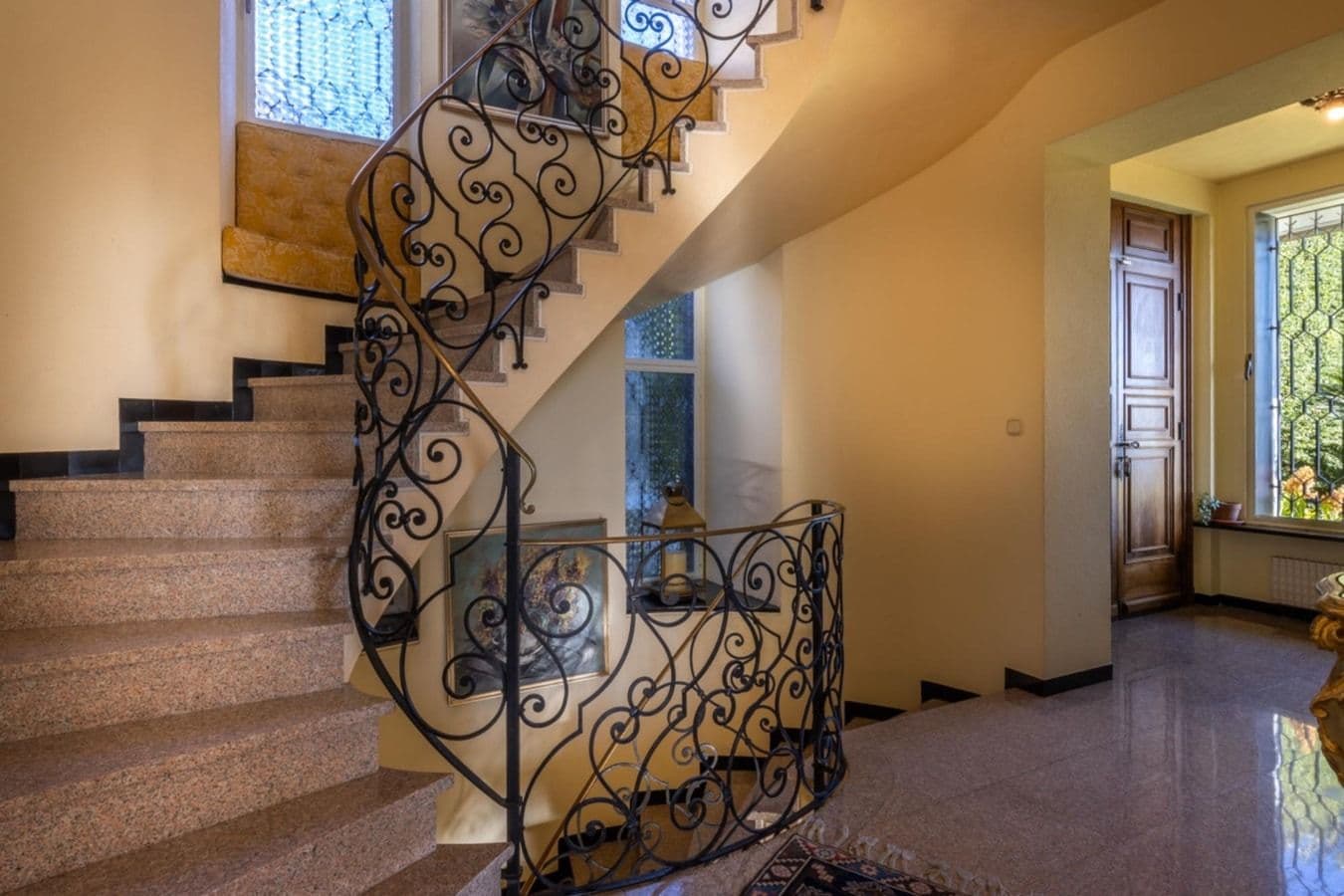 Wrought-iron staircase inside On the Emerald Coast, Rapallo