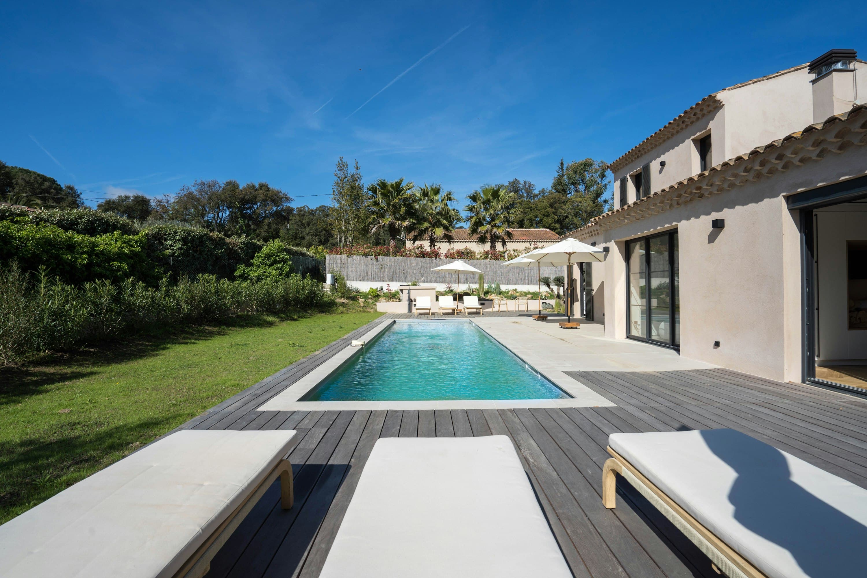 Riviera Echo villa exterior with lap pool and dark wood deck, Saint-Tropez, France