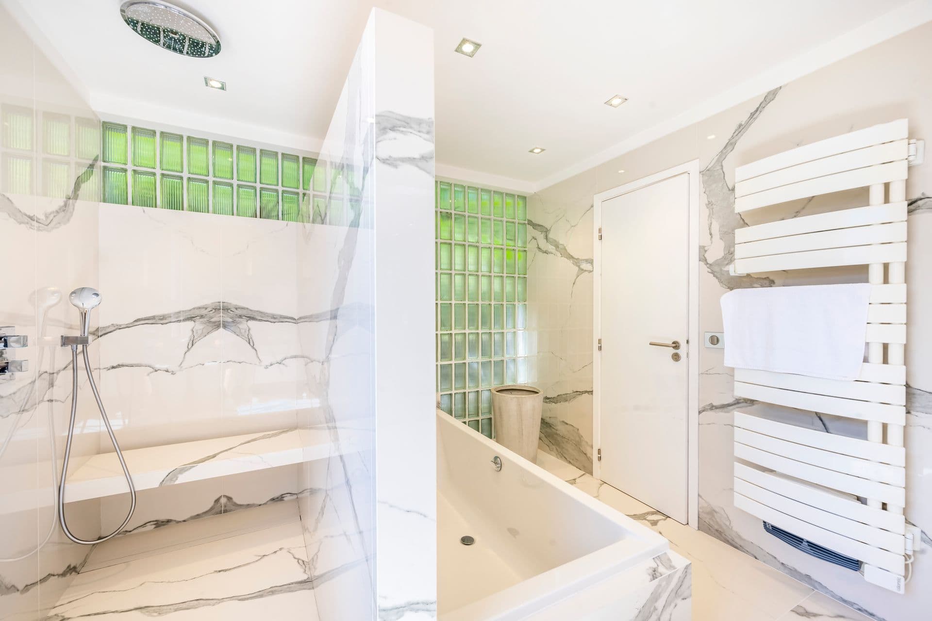 Bathroom with green tiled walk-in shower at Olive and Sea