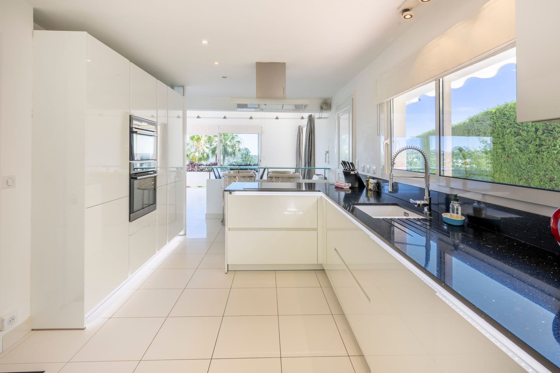 Bright fitted kitchen with garden views at Olive and Sea