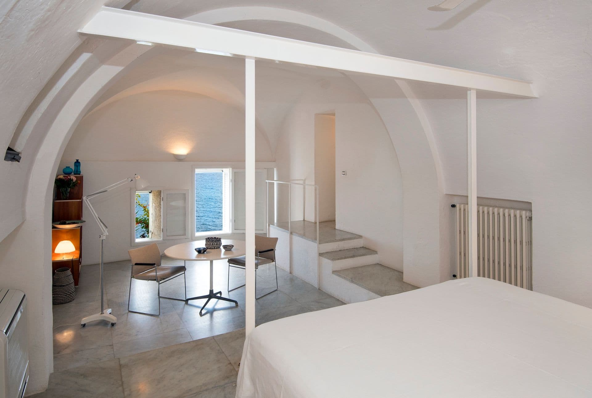 Bedroom with vaulted ceiling, mezzanine steps and sea-facing window