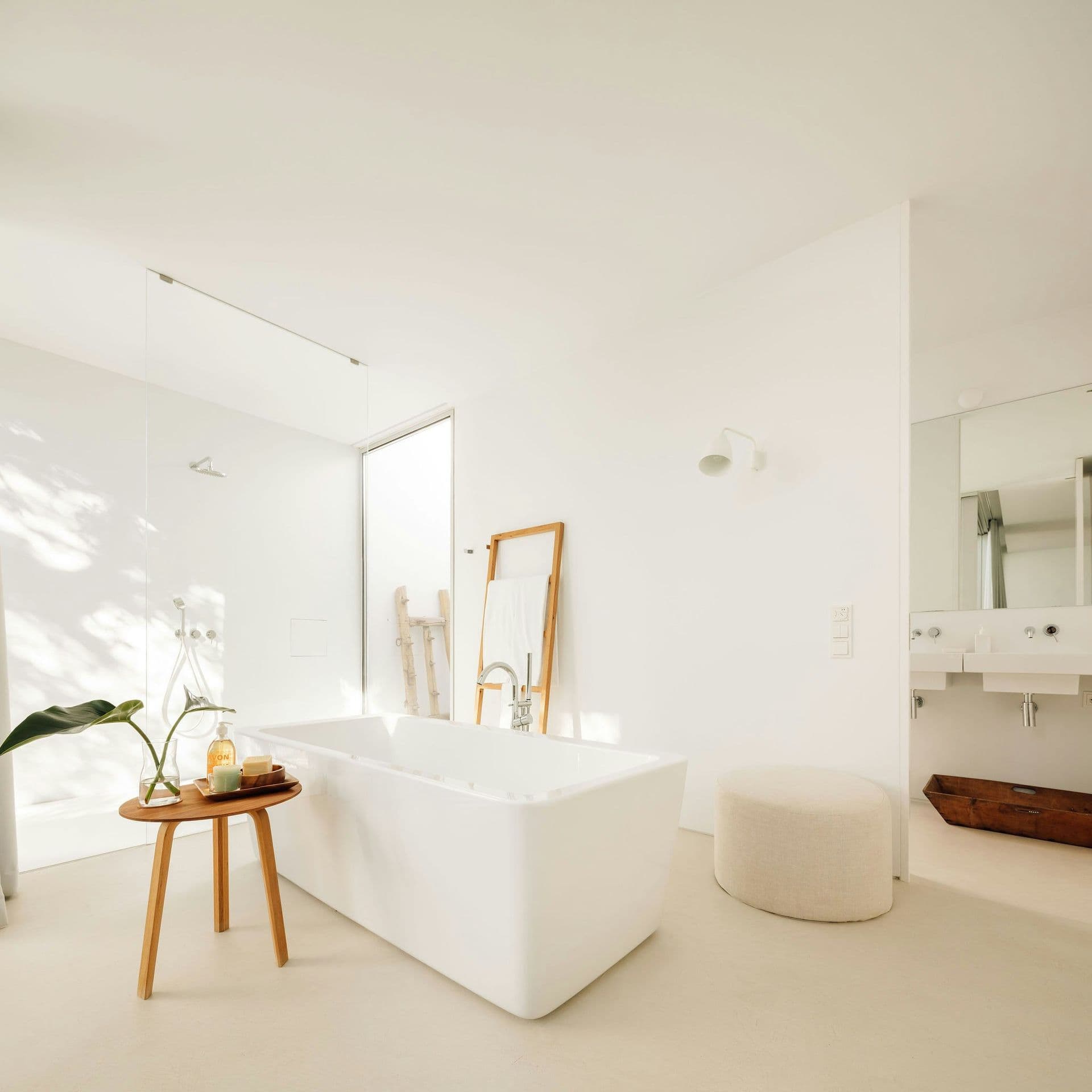 Sculptural freestanding bath in a white bathroom at The Spirit of Joy, Comporta