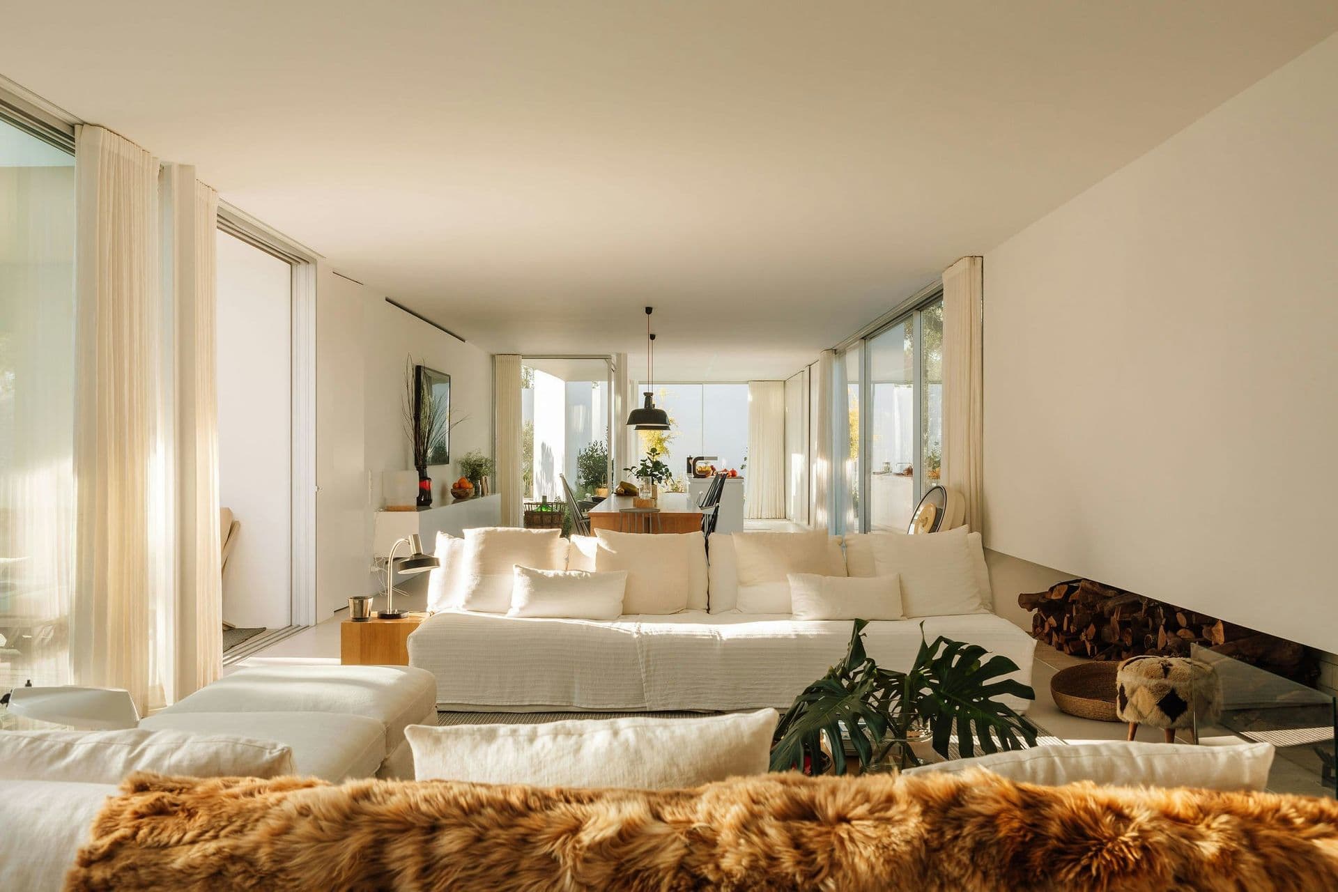 Minimalist white living room opening to the trees at The Spirit of Joy, Comporta