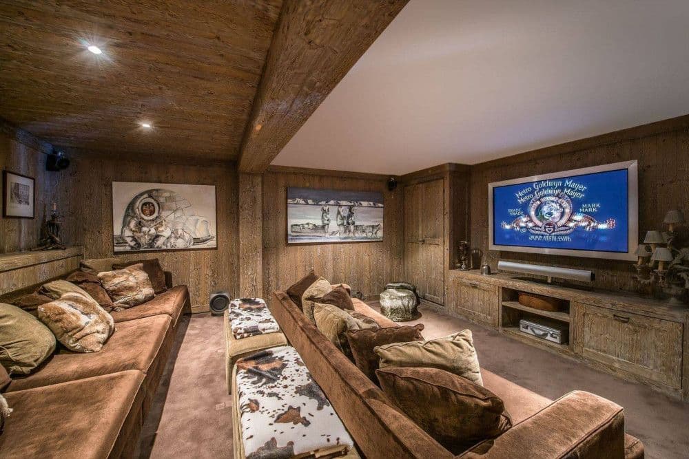 Home cinema snug with a large screen and deep sofas at Meribel 139