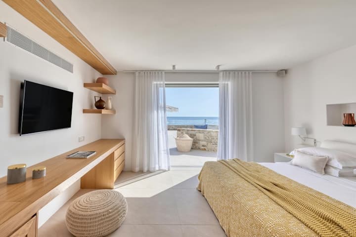 Golden Tide Houses master bedroom with sea views, Agios Ioannis, Cyclades Islands, Greece