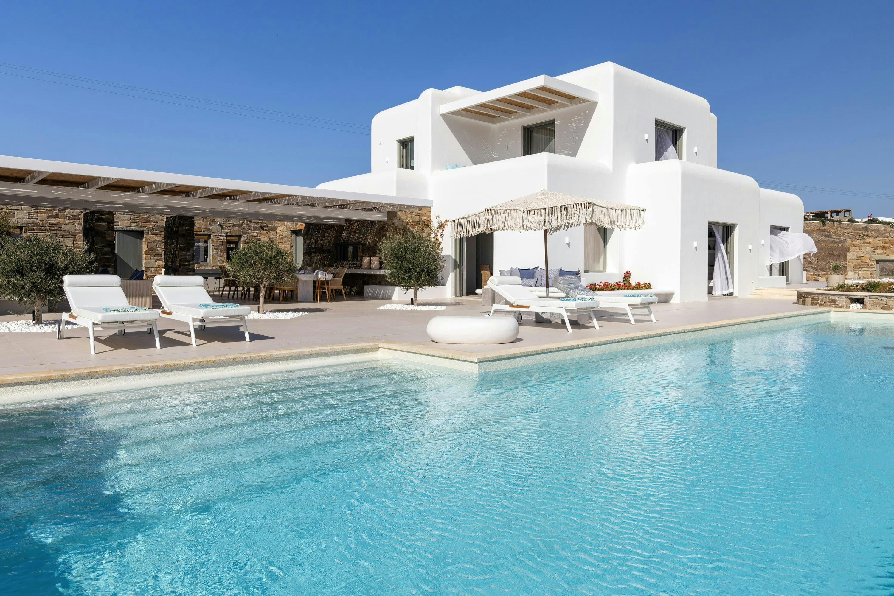 Golden Tide Houses villa exterior with infinity pool and Aegean views, Agios Ioannis, Greece