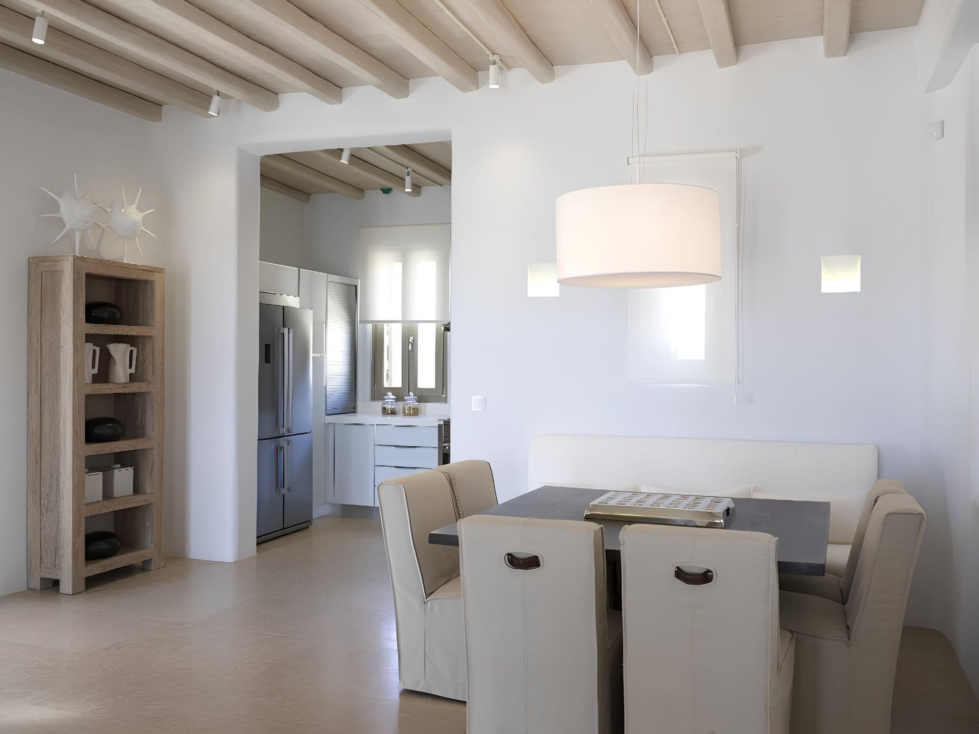 White cabinetry kitchen with an adjoining breakfast dining nook.