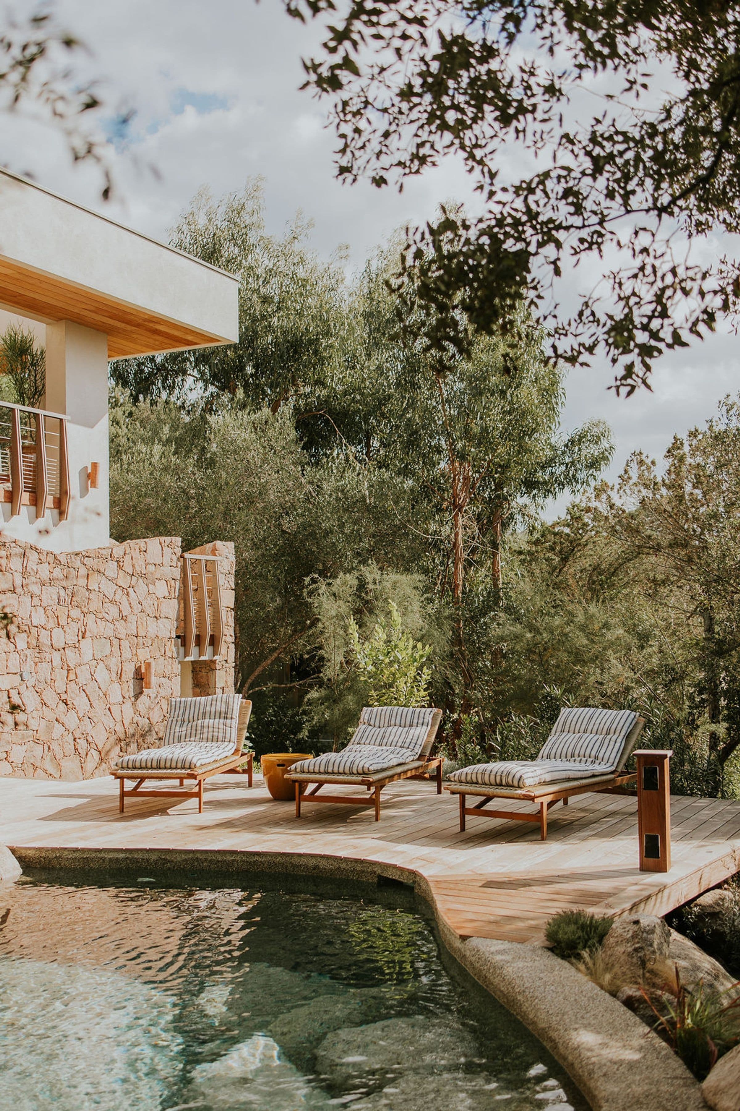 Casa Rossa natural pool edge detail with organic stonework, Porto-Vecchio, Corsica, France