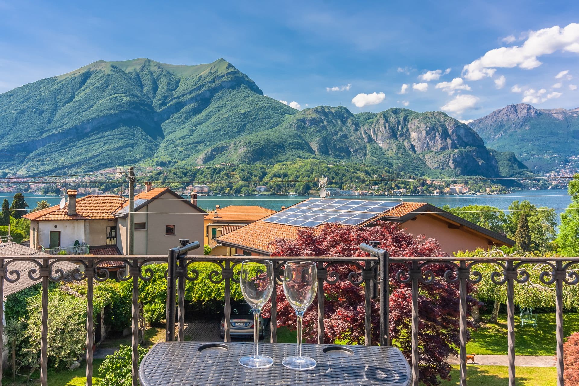 Balcony set for drinks with panoramic Lake Como and mountain views at So Bellagio