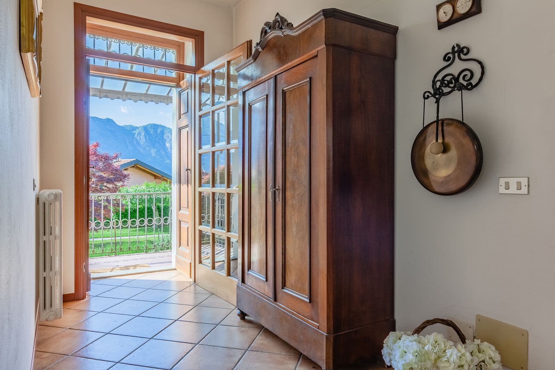 Entrance hallway with a traditional wooden wardrobe at So Bellagio