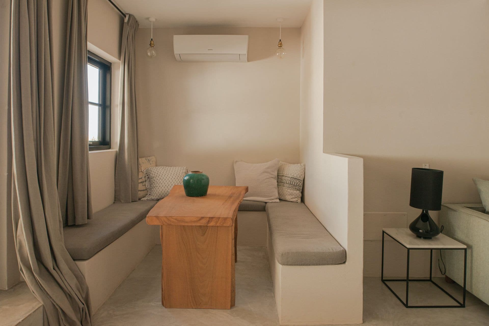 Cushioned built in bench seating in a cosy alcove at New Beat