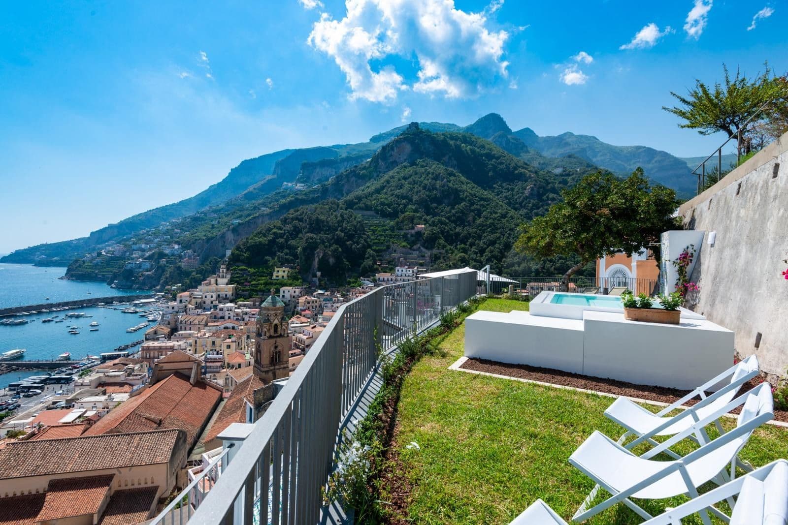 Elevated terrace looking down over Amalfi town, harbour and the coastal mountains