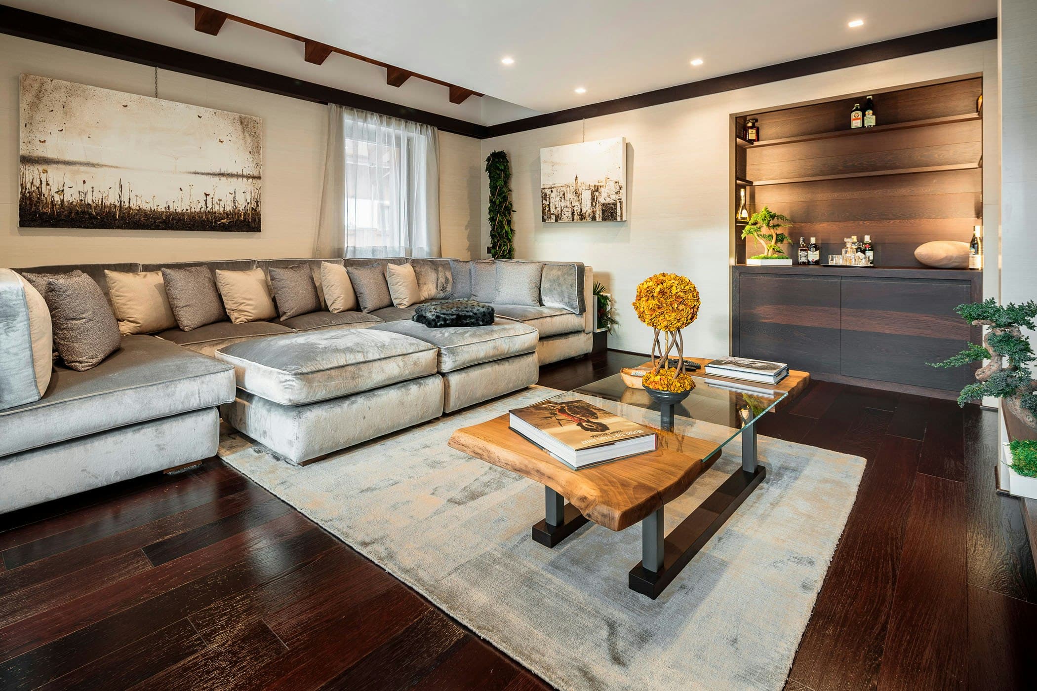 Dolomite Prestige living room with velvet sectional and built-in bar, Cortina d'Ampezzo, Italy
