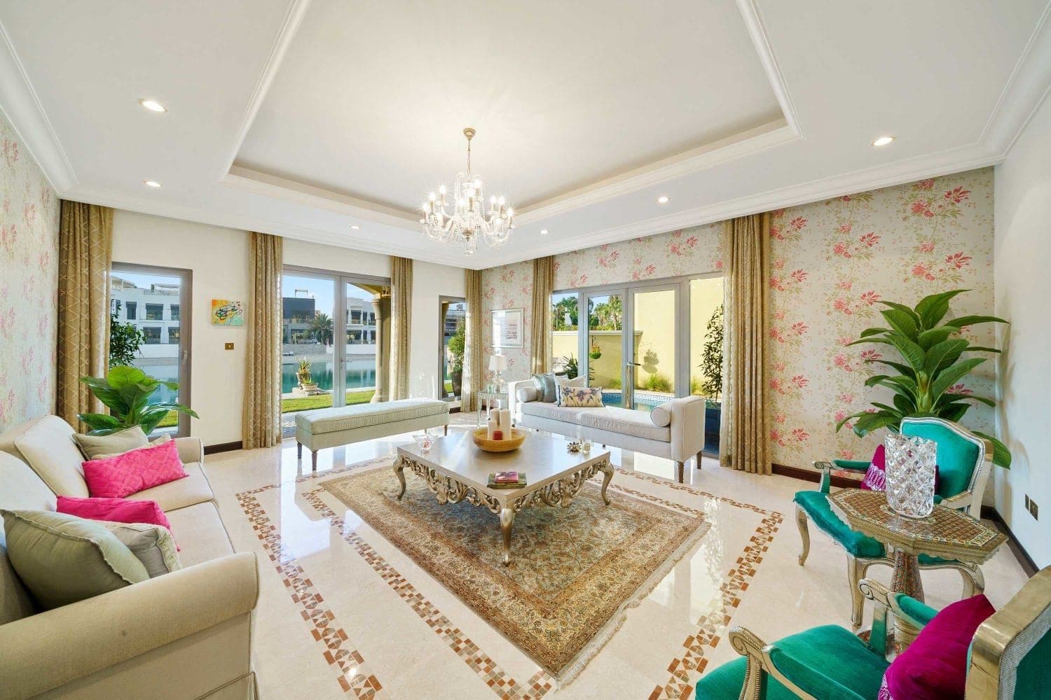 Second sitting room with floral wallpaper and pink and green accents at A Place in the Palms, Palm Jumeirah